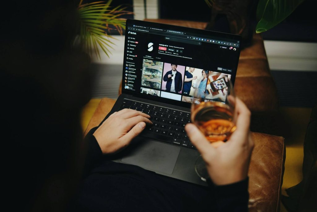 Person browsing tiktok on a laptop
